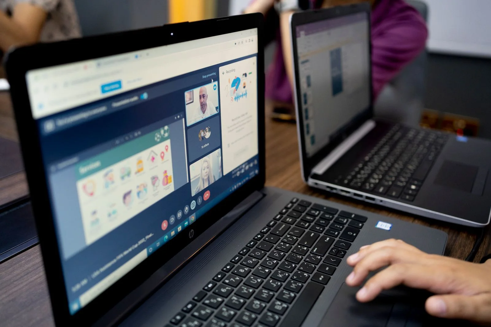 Students following a structured online class through a laptop